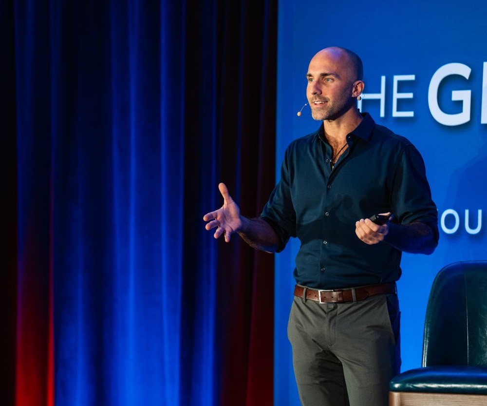 Joe Ruotolo speaking on stage